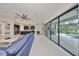 Open-concept living area seamlessly connects indoor & outdoor spaces with expansive sliding glass doors at 11408 Drifting Leaf Dr, Riverview, FL 33579