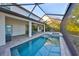 Spacious screened patio featuring a pool, spa, and outdoor dining area, great for entertaining at 11408 Drifting Leaf Dr, Riverview, FL 33579