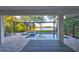 Enclosed pool and spa area with scenic lake views and ample space for relaxation at 11408 Drifting Leaf Dr, Riverview, FL 33579
