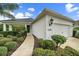 Well-maintained front exterior view of a single Gathering home with a walkway leading to the front door at 12225 Whisper Lake Dr, Bradenton, FL 34211