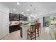 Open concept kitchen features granite countertops, stainless steel appliances and a kitchen island with seating at 12225 Whisper Lake Dr, Bradenton, FL 34211