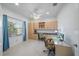 Bright office space with a window, built in cabinets, and a glass desk with rolling chairs at 12225 Whisper Lake Dr, Bradenton, FL 34211