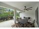 Covered patio with outdoor seating and a ceiling fan perfect for entertaining at 12225 Whisper Lake Dr, Bradenton, FL 34211