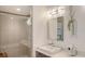 Contemporary bathroom with a glass-enclosed shower, modern vanity, and stylish fixtures at 129 Taft Dr # W102, Sarasota, FL 34236