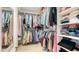 Organized walk-in closet featuring ample shelving and hanging space for clothes and accessories at 129 Taft Dr # W102, Sarasota, FL 34236