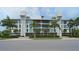 Modern apartment building with unique exterior design and lush landscaping at 129 Taft Dr # W102, Sarasota, FL 34236