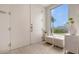 Bright modern foyer featuring white doors, tile floors, and contemporary decor at 129 Taft Dr # W102, Sarasota, FL 34236