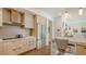 Modern kitchen featuring stainless steel appliances, light wood cabinets, and bar seating at 129 Taft Dr # W102, Sarasota, FL 34236