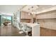 Well-lit kitchen with modern appliances, an island with bar seating, and sleek finishes at 129 Taft Dr # W102, Sarasota, FL 34236