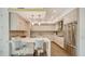 Contemporary kitchen with stainless appliances, an island with seating, and ample counter space at 129 Taft Dr # W102, Sarasota, FL 34236