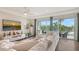 Cozy living room featuring a large sectional sofa and access to a balcony at 129 Taft Dr # W102, Sarasota, FL 34236