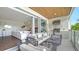 Outdoor patio with comfortable seating, a grill, and views of the surrounding landscape at 129 Taft Dr # W102, Sarasota, FL 34236