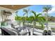 Inviting patio with outdoor furniture, a grill, and views of lush landscaping at 129 Taft Dr # W102, Sarasota, FL 34236