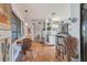 Cozy dining area featuring terracotta tile, a wooden table and view to the kitchen at 1901 Deancroft Rd, Sarasota, FL 34235