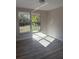 Light-filled bedroom features a large window and modern flooring at 2020 45Th Street Ct E # A, Bradenton, FL 34208