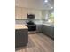 This kitchen boasts modern stainless steel appliances, dual-tone cabinets, and sleek countertops at 2020 45Th Street Ct E # A, Bradenton, FL 34208