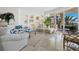 Inviting living area with elegant furniture, stylish decor, and sliding glass doors to a balcony showcasing a serene coastal view at 2161 Gulf Of Mexico Dr # 3, Longboat Key, FL 34228