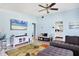 Spacious living room with blue walls and neutral furnishings, offering an open view to the kitchen at 2564 Wood St, Sarasota, FL 34237