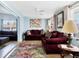 Comfortable living room with stylish furnishings, wood floors, and a colorful rug at 2564 Wood St, Sarasota, FL 34237