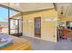 Enclosed patio with a hot tub area, wooden deck, and a table with chairs at 2564 Wood St, Sarasota, FL 34237