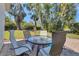 Landscaped backyard with a table and seating area, perfect for outdoor dining and entertaining at 3333 Yonge Ave # 13, Sarasota, FL 34235