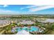 Aerial view of a resort-style community pool and clubhouse surrounded by lush landscaping and homes at 3639 Santa Caterina Blvd, Lakewood Ranch, FL 34211