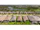 An aerial of a home showcases its tile roof and landscaping, nestled in a community near a serene pond and golf course at 3639 Santa Caterina Blvd, Lakewood Ranch, FL 34211