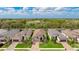 Aerial view of the single-story home with tile roof and paver driveway in a well-maintained neighborhood at 3639 Santa Caterina Blvd, Lakewood Ranch, FL 34211