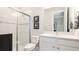 Bright bathroom with a glass-enclosed shower, sleek white vanity, and a modern faucet at 3639 Santa Caterina Blvd, Lakewood Ranch, FL 34211