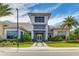 Elegant clubhouse exterior featuring a modern design, lush landscaping, and a welcoming entrance at 3639 Santa Caterina Blvd, Lakewood Ranch, FL 34211