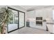 Gourmet kitchen with modern appliances, a wine fridge, and a sliding glass door to the outdoors at 3639 Santa Caterina Blvd, Lakewood Ranch, FL 34211