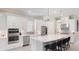 Well-equipped kitchen with white cabinets, stainless steel appliances, and a spacious island at 3639 Santa Caterina Blvd, Lakewood Ranch, FL 34211
