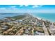 Aerial view of a beach community, showcasing homes near the beach, shopping, and recreation at 4101 4Th Ave, Holmes Beach, FL 34217