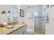 Modern bathroom featuring granite countertops, a glass walk-in shower, and turtle decor at 4101 4Th Ave, Holmes Beach, FL 34217