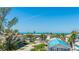 Waterfront view of the beach and neighboring rooftops at 4101 4Th Ave, Holmes Beach, FL 34217