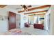 Spacious bedroom features beam ceilings, tile floors, comfortable seating, and a large sliding glass door at 4101 4Th Ave, Holmes Beach, FL 34217
