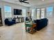 A cozy living room featuring tile floors, comfortable seating, and bright natural light at 4101 4Th Ave, Holmes Beach, FL 34217