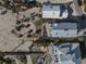 Overhead view showing well-maintained homes with patios and decks in a desirable coastal neighborhood at 412 S Casey Key Rd, Nokomis, FL 34275