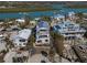 Stunning aerial view of beachfront homes with balconies and a lush green waterway at 412 S Casey Key Rd, Nokomis, FL 34275