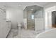 Spacious bathroom with glass shower, toilet, and vanity featuring luxurious marble tile at 412 S Casey Key Rd, Nokomis, FL 34275