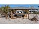 Charming beach gazebo with seating, perfect for enjoying the views of nearby beach homes and coastal scenery at 412 S Casey Key Rd, Nokomis, FL 34275