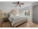 Relaxing bedroom with a cozy bed, neutral decor, and natural light, creating a serene and inviting retreat at 412 S Casey Key Rd, Nokomis, FL 34275