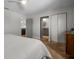 Bright bedroom leads to ensuite bathroom, showcasing a neutral color scheme and ample closet space at 412 S Casey Key Rd, Nokomis, FL 34275