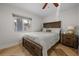 Cozy bedroom with a comfortable bed, rustic decor, and natural light, creating a warm and inviting atmosphere at 412 S Casey Key Rd, Nokomis, FL 34275