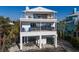 Modern house with multiple decks and balconies offers stunning views at 412 S Casey Key Rd, Nokomis, FL 34275