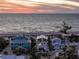 Exterior of beachfront home with a gorgeous sunset view at 412 S Casey Key Rd, Nokomis, FL 34275