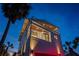 Modern home with balconies and stylish lighting, near palm trees and beach at 412 S Casey Key Rd, Nokomis, FL 34275