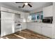 Efficient kitchen with white cabinetry, modern appliances, and ample counter space for all your cooking needs at 412 S Casey Key Rd, Nokomis, FL 34275