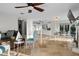 Bright open-concept space with tile floors that seamlessly connects the living, dining, and kitchen areas at 412 S Casey Key Rd, Nokomis, FL 34275
