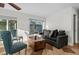 Cozy living room with comfortable seating, stylish decor, and natural light, perfect for relaxing and entertaining at 412 S Casey Key Rd, Nokomis, FL 34275